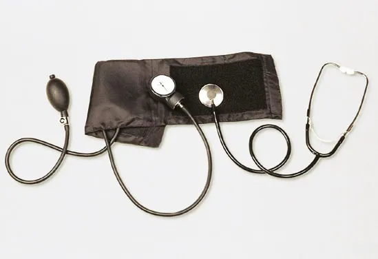 A blood pressure cuff with its pump and gauge, and a stethoscope